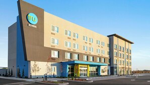 A modern hotel building with a prominent 'tru by Hilton' sign, multiple windows, and a covered entrance area. - Tru By Hilton Lodi (Lodi)