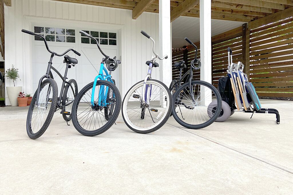 A covered outdoor area with bicycles and a wheelchair.