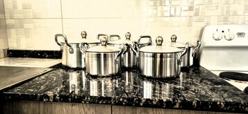 Full-sized fridge, microwave, oven, cookware/dishes/utensils