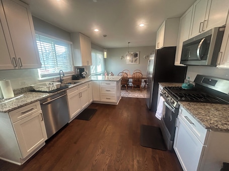 Paper towels, dining tables. PROMO 10% WEEKLY 15% MONTHLYOFFCozy Family Retreat: King Beds, Garage, Fast WiFi