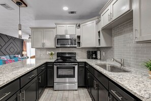Fridge, microwave, oven, stovetop - Midtown Modern - Extended Stay (Bryan)