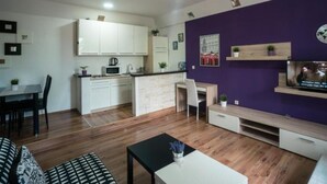 A modern apartment with a kitchen, dining area, and living room. - One bedroom apartment (Rakovica)