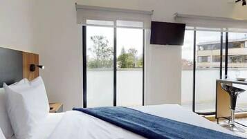 1 bedroom, blackout drapes, soundproofing, iron/ironing board