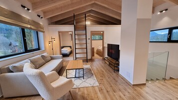 Deluxe Apartment, 2 Bedrooms | Living area | Flat-screen TV