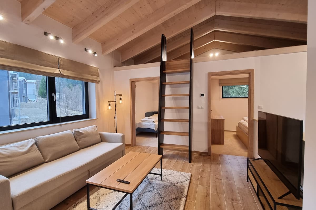 Deluxe Apartment, 2 Bedrooms | Living area | Flat-screen TV