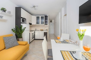 Apartment, Beach View | Private kitchen | Full-size fridge, microwave, oven, stovetop