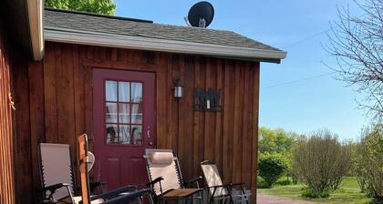 Located behind a tree filled garden near our horse barn and Farm Sanctuary.