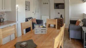 A compact living space with a kitchen, dining area, and seating area.