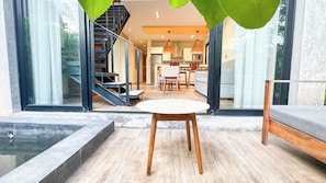 Deluxe Apartment, Garden View | Living area | 42-inch Smart TV with digital channels, Netflix, streaming services