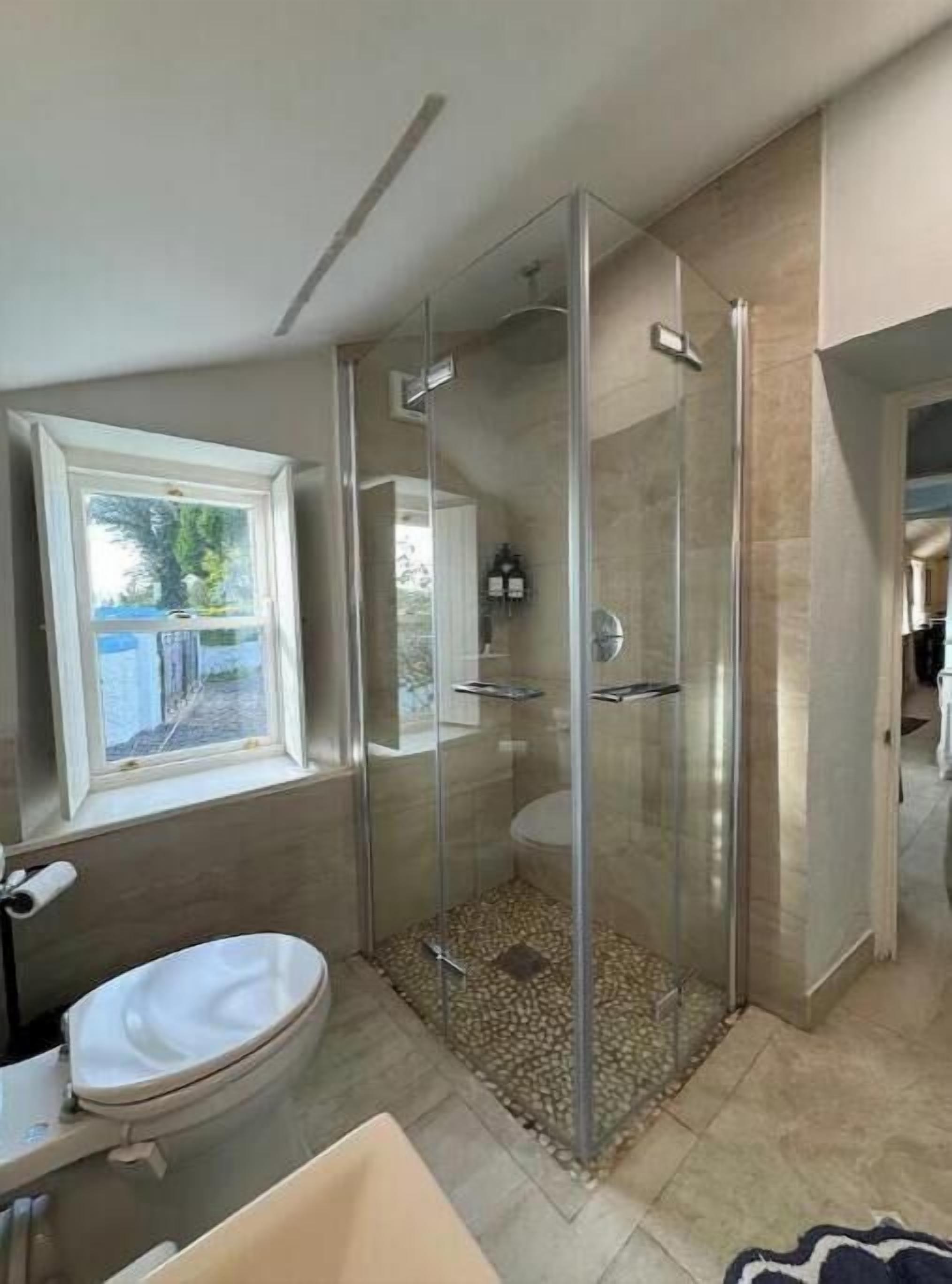 Shower, hair dryer, towels, soap