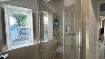 Shower, hair dryer, towels, soap