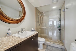Shower, towels, soap, toilet paper