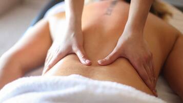 A person receiving a back massage.