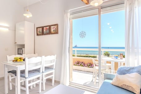 Dining. Apartment 'Sunrise Medes' with Sea View, Shared Pool and Wi-Fi