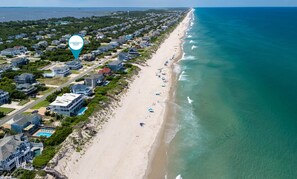 A coastal residential area with beachfront properties, a beach, and a clear view of the ocean. - A Golden Opportunity: Semi-Oceanfront w/Heated Pool, Hot Tub and Across from Beach! (Corolla)