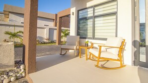 A patio with two rocking chairs, a small table, and a potted plant. - D&D Divine Suite
Ocho Rios, St. Ann Parish (Ocho Rios)