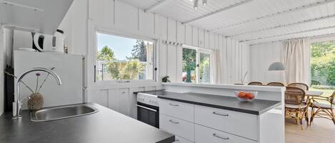 Fridge, stovetop, dishwasher, coffee/tea maker
