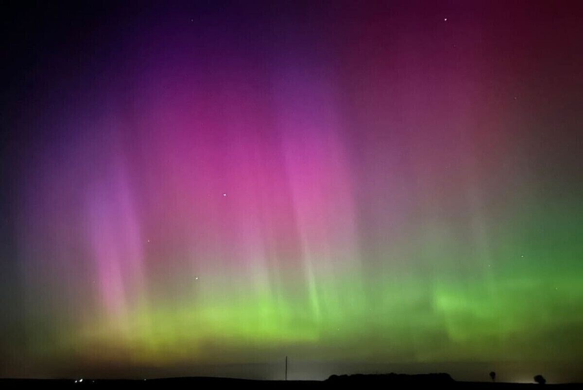A night sky with the aurora borealis.