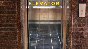 An elevator with a digital display and a sign that reads "ELEVATOR". - Devraha Seva Ashram - Vrindavan (Mathura)