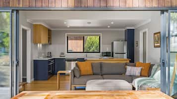 Comfort Cabin, River View | Living area | 50-inch Smart TV with digital channels, Netflix, Hulu
