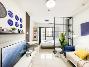 Standard Condo, 1 Queen Bed, Refrigerator & Microwave | Living area | 43-inch flat-screen TV with digital channels