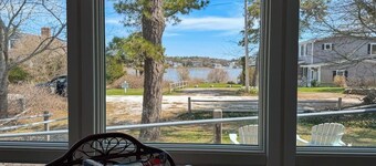 Water-view house near golf with firepit, grill, deck, central AC & washer/dryer