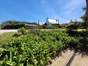 Stroll through the beautifully maintained garden, surrounded by a variety of plants and flowers, and enjoy the peaceful atmosphere.