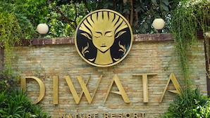 A sign for Diwata Nature Resort with a circular emblem and the resort's name in large letters. - Diwata Nature Resort (San Pablo)