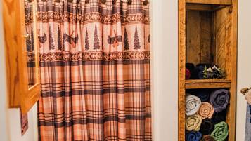 Shower, hair dryer, towels, toilet paper
