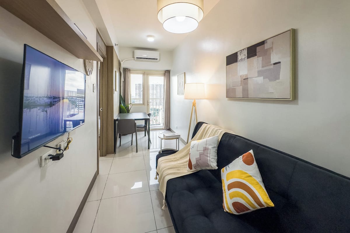 Appart'hôtel Design, coin cuisine, vue ville | Coin séjour