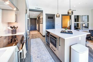 Fridge, microwave, oven, stovetop - One Riverfront Condo 208 (Avon)