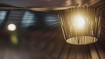 A close-up of a hanging light fixture with a geometric design.