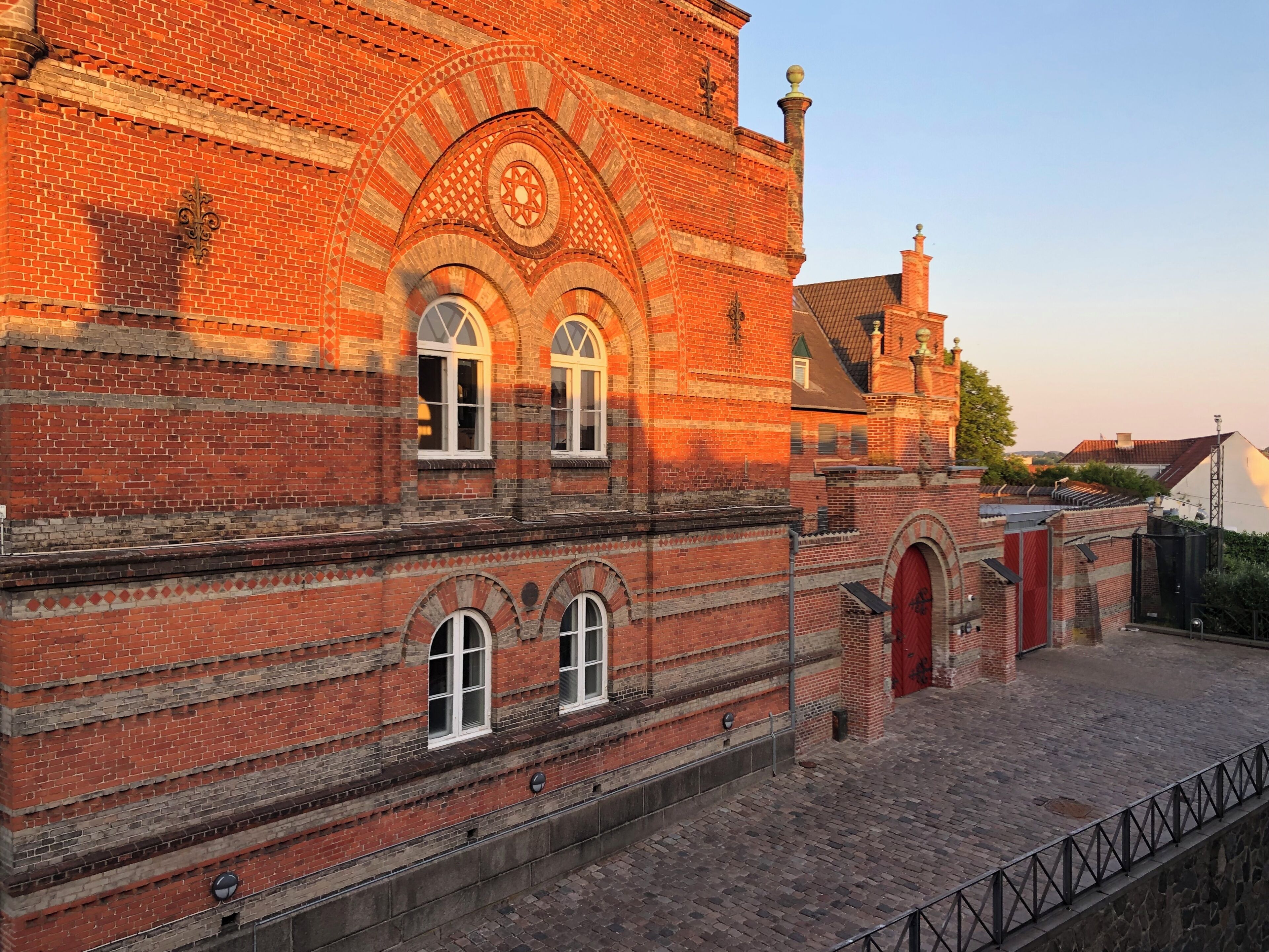 A historic building with arched windows and a brick facade.