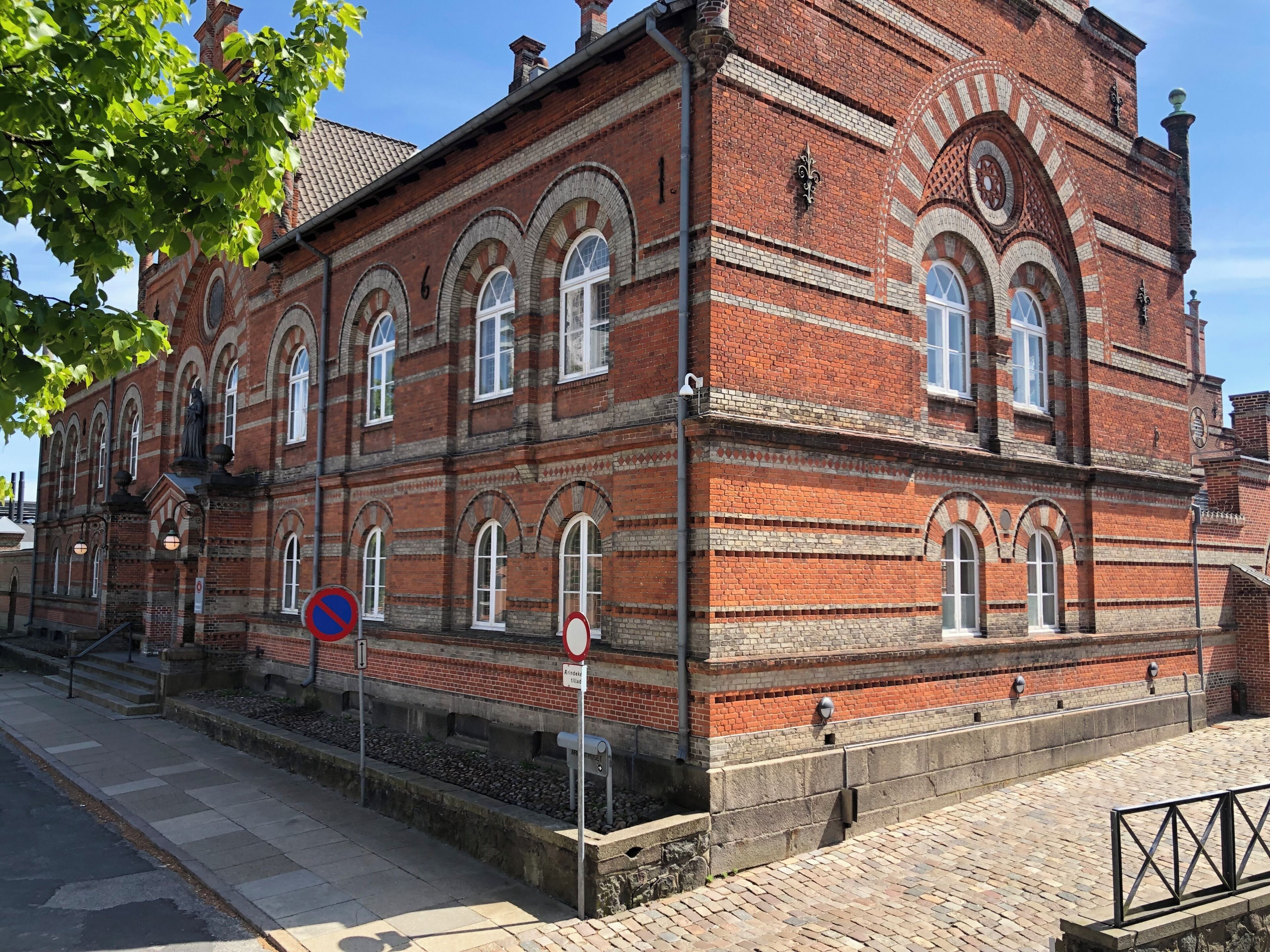 A historic building with arched windows and a brick facade.