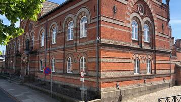 A historic building with arched windows and a brick facade.