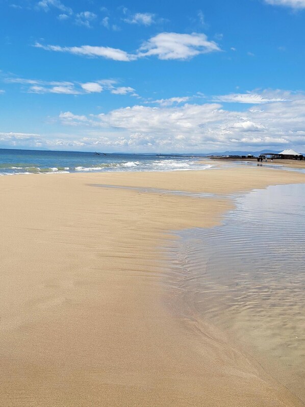 On the beach, sun-loungers
