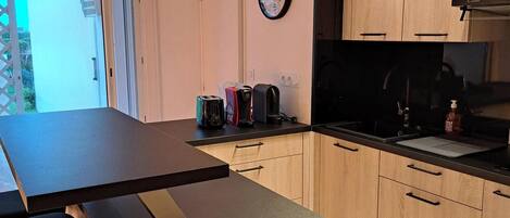 Fridge, microwave, stovetop, coffee/tea maker