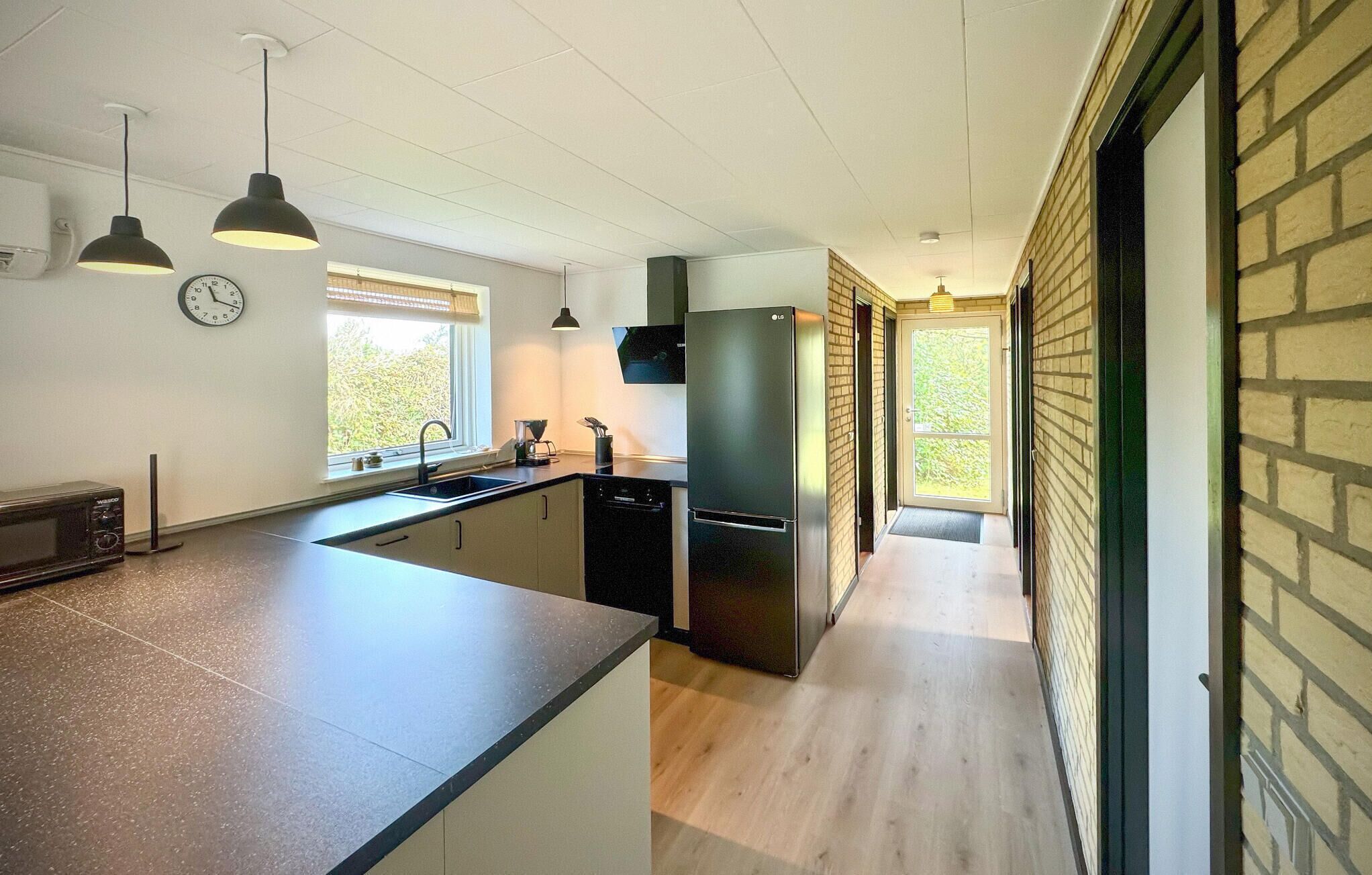 Fridge, stovetop, dishwasher, coffee/tea maker