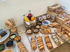 A buffet table with various food items and beverages. - Cabana White Boutique Hotel  (Kos)