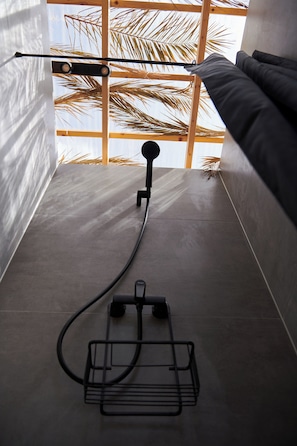 Shower, rainfall showerhead, hair dryer, towels
