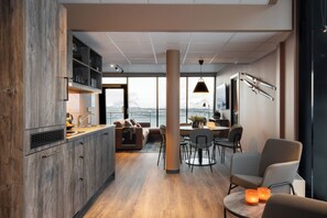 Suite, Ocean View | Living area | Flat-screen TV, streaming services - Basecamp Narvik (Narvik)