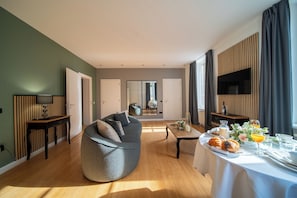Junior Suite | Living area | 32-inch flat-screen TV with cable channels