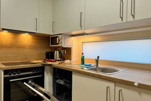 Family Studio Suite, Balcony, Courtyard View | Private kitchen | Full-size fridge, microwave, oven, stovetop