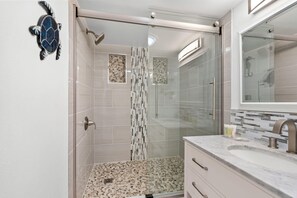 Shower, hair dryer, towels, shampoo