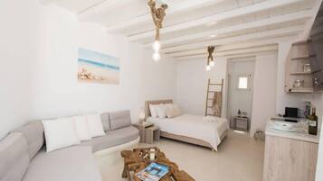 Tabla de planchar con plancha, wifi y ropa de cama