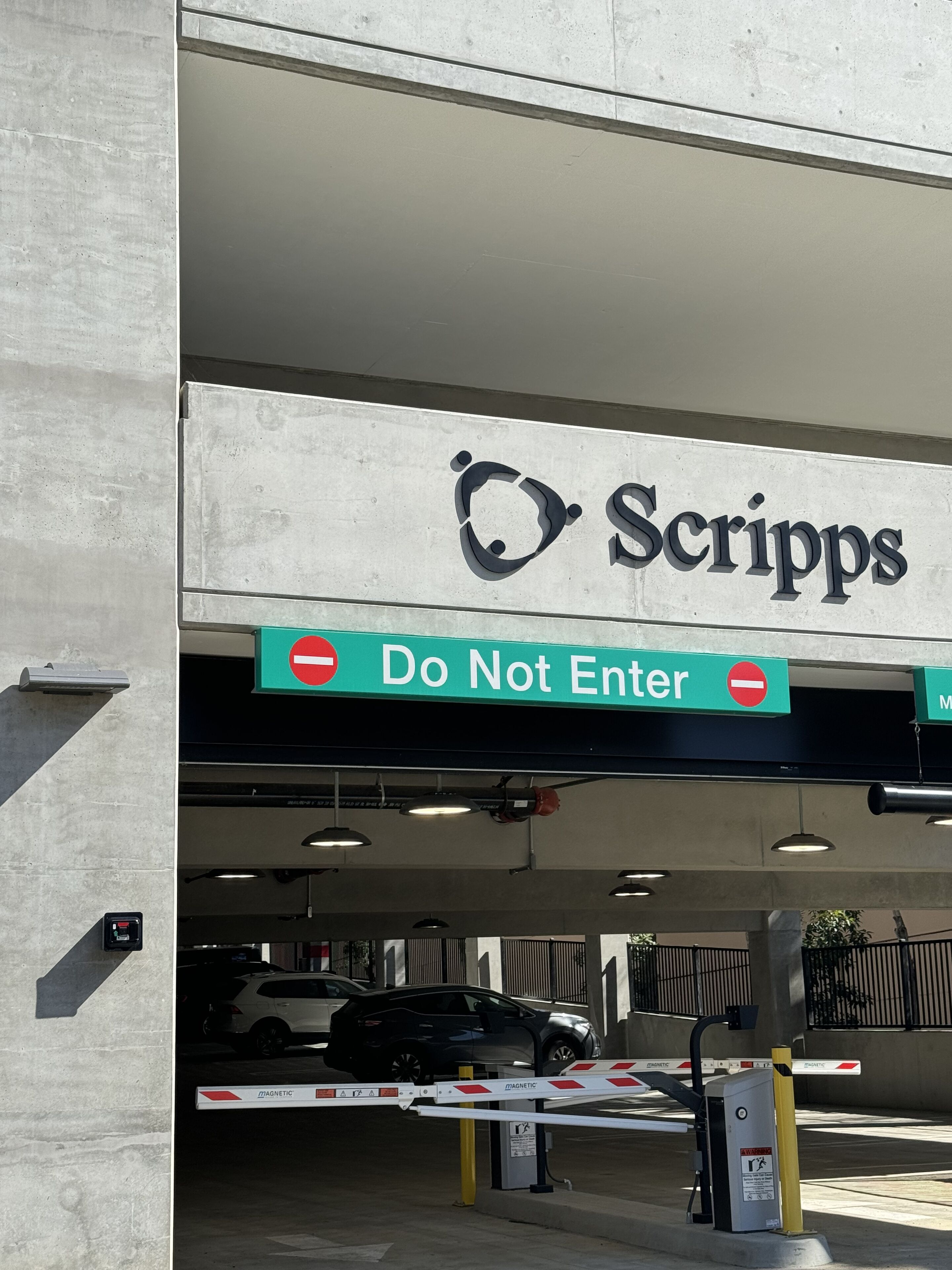 A parking garage entrance with a 'Do Not Enter' sign and a 'Scripps' sign above.