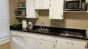 Fridge, microwave, stovetop, coffee/tea maker