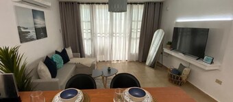 Relax at Bahía Real – Poolside Balcony Escape