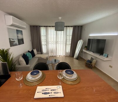 Relax at Bahía Real – Poolside Balcony Escape