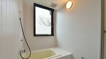 Bathroom | Combined shower/tub, deep soaking tub, hair dryer, bathrobes